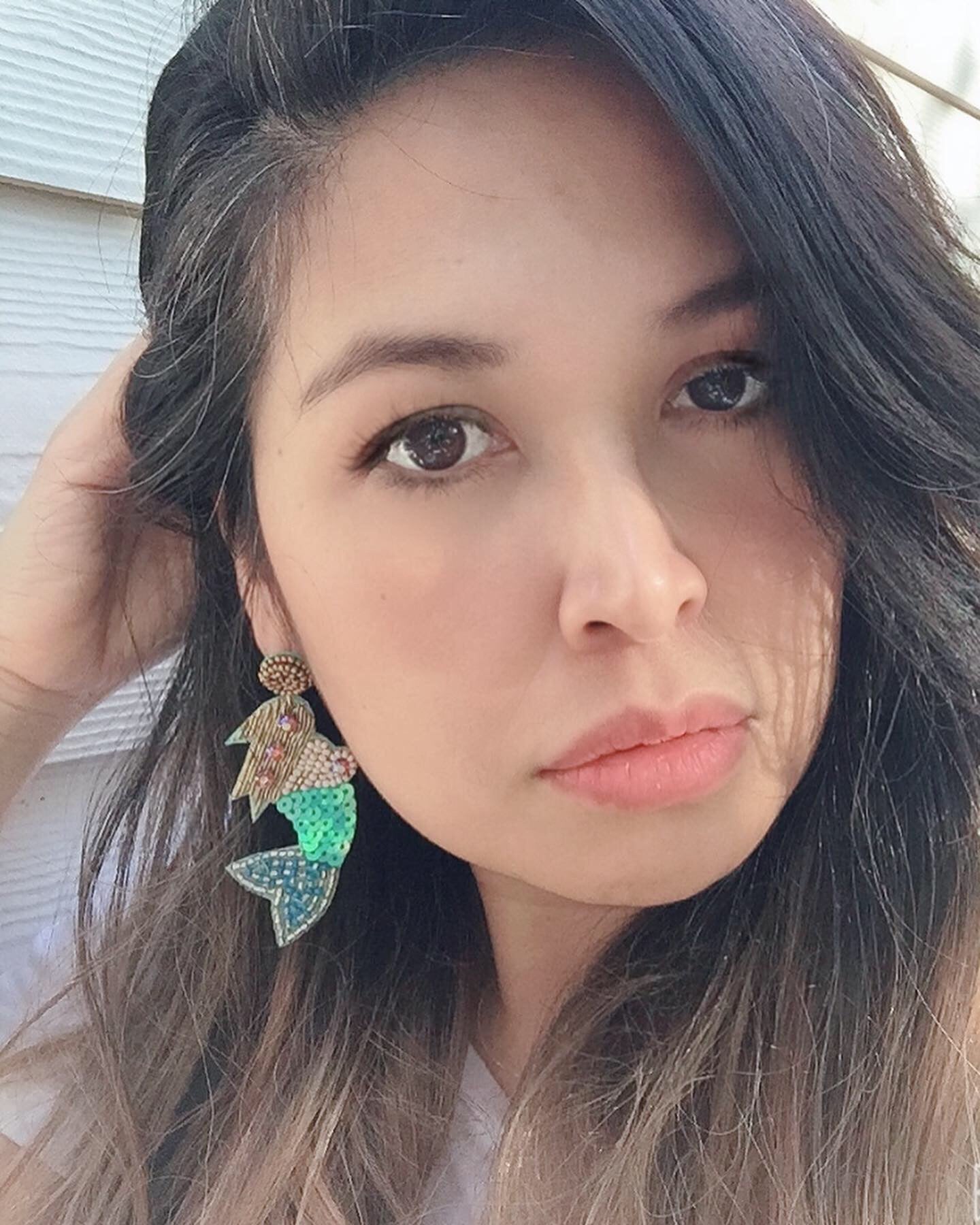 women wearing beaded mermaid earrings